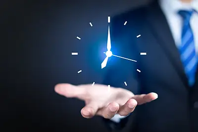 photo of a clock in man's hand